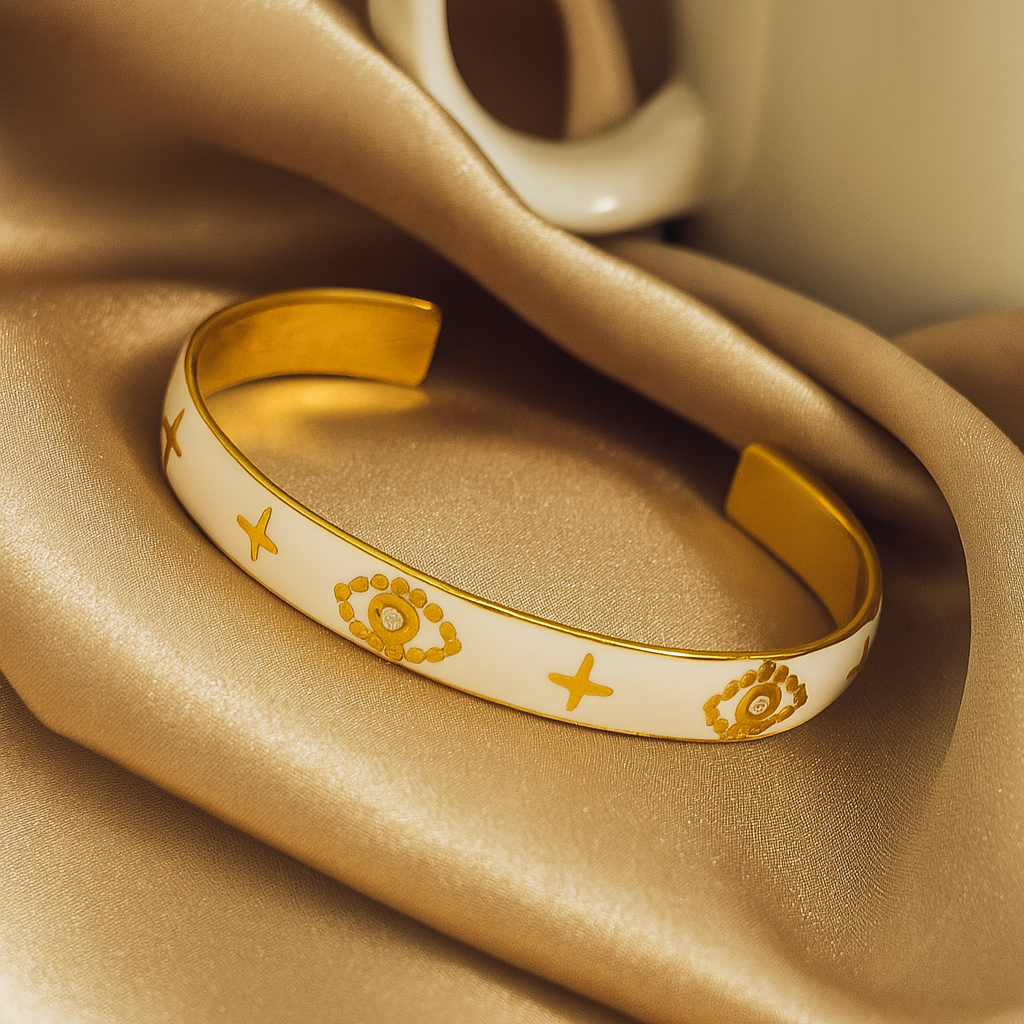 Gold bracelet with floral patterns on beige fabric