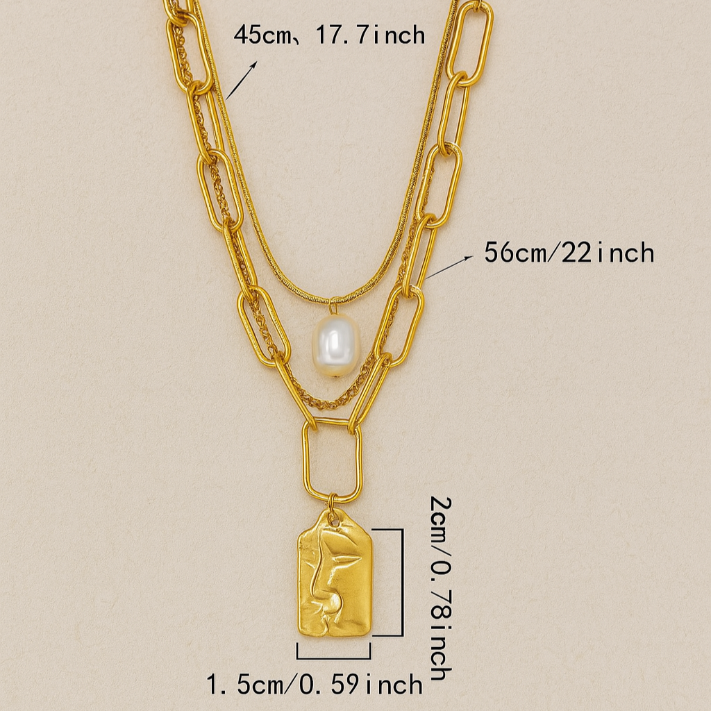 Gold chain necklace with measurements on a beige background