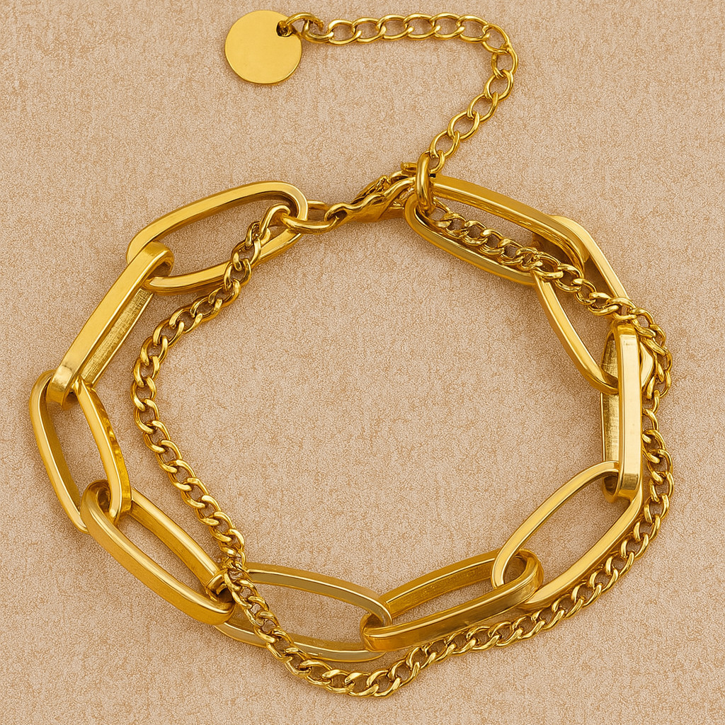 Gold chain bracelet on a beige background