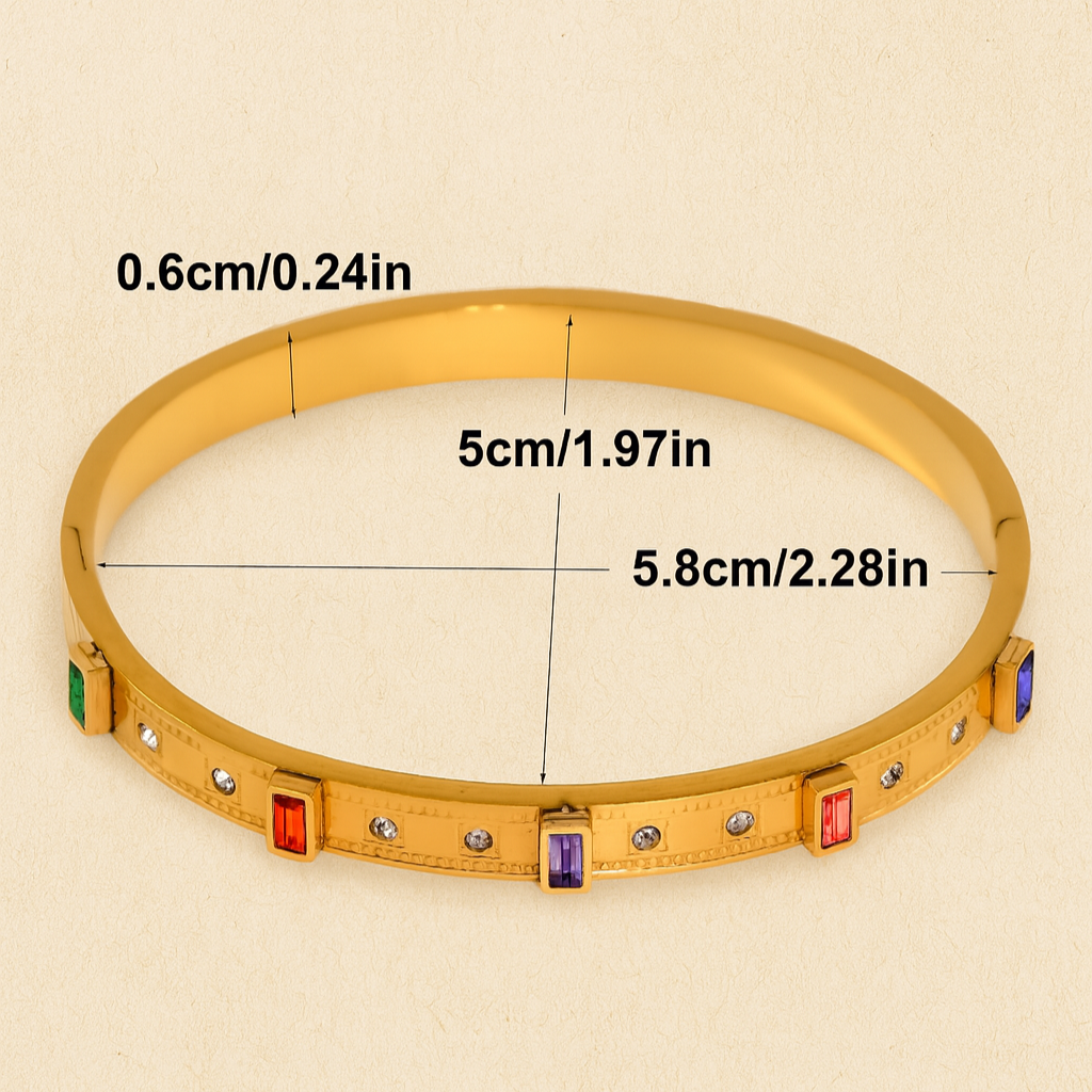 Gold bracelet with measurements on a beige background