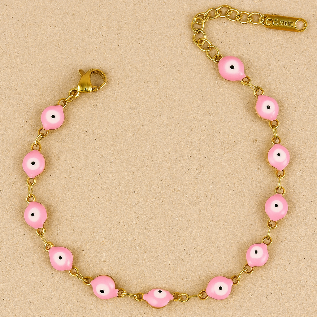 Bracelet with pink beads and gold chain on a beige background