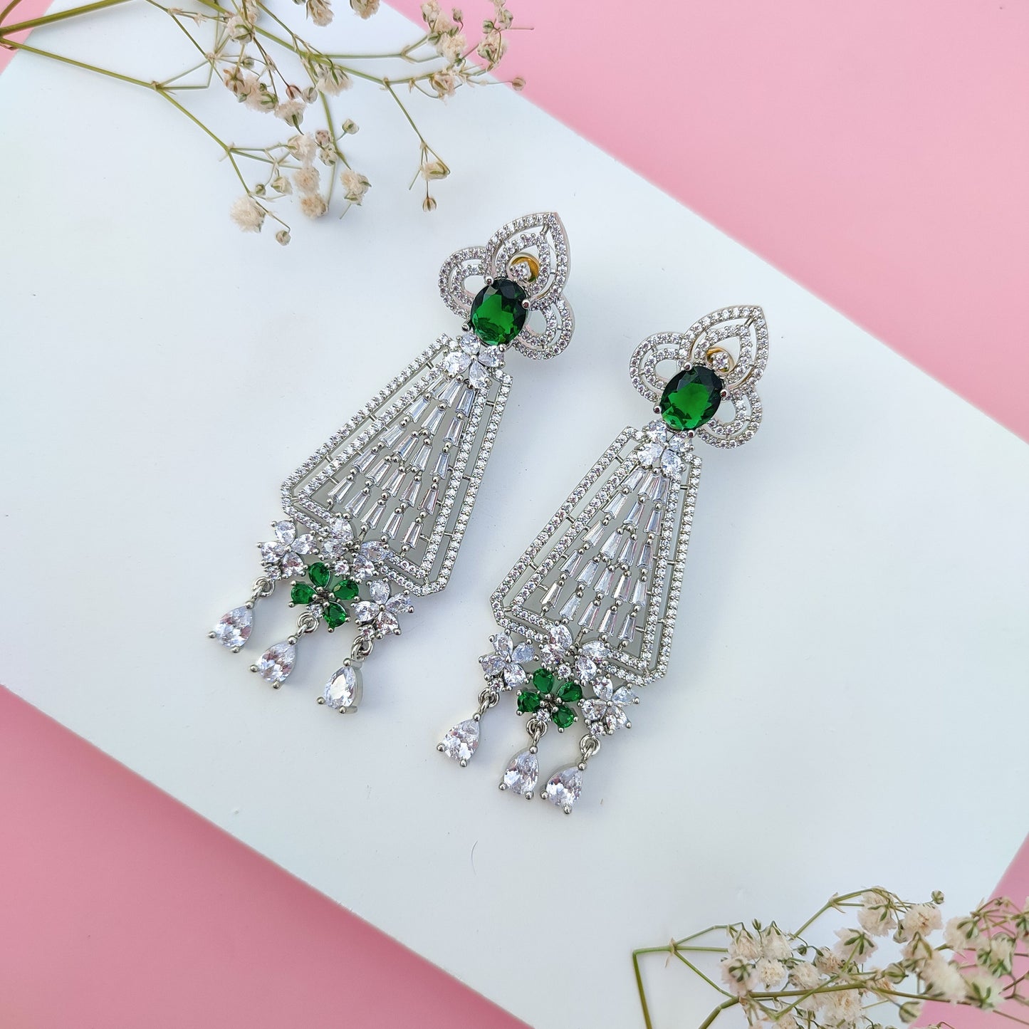 Festive rhinestone earrings with green gemstones