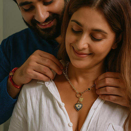 Man adjusting a necklace on a woman's neck, both smiling.